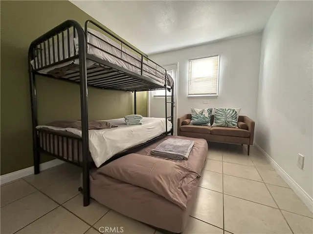 a bedroom with furniture and a window