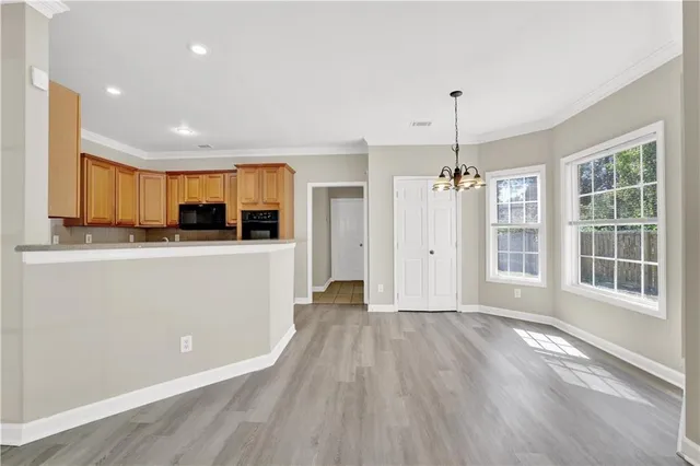 a view of a kitchen with a sink cabinet and a window
