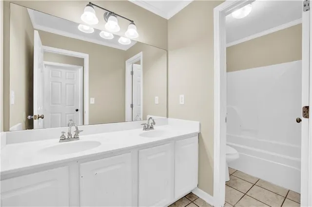 a bathroom with a sink double vanity and a mirror