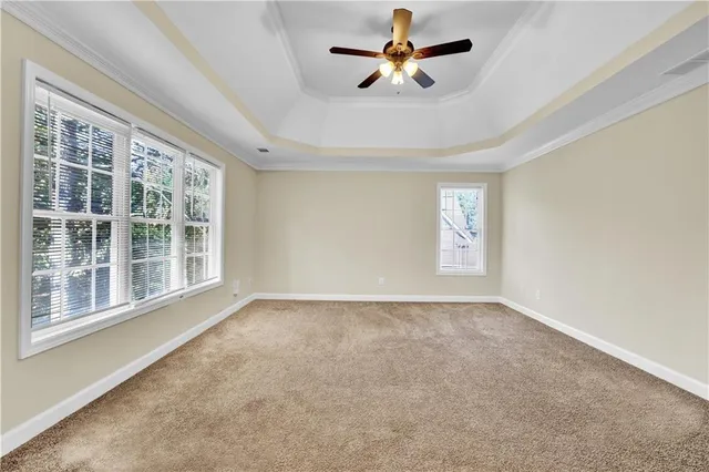 a view of empty room with windows