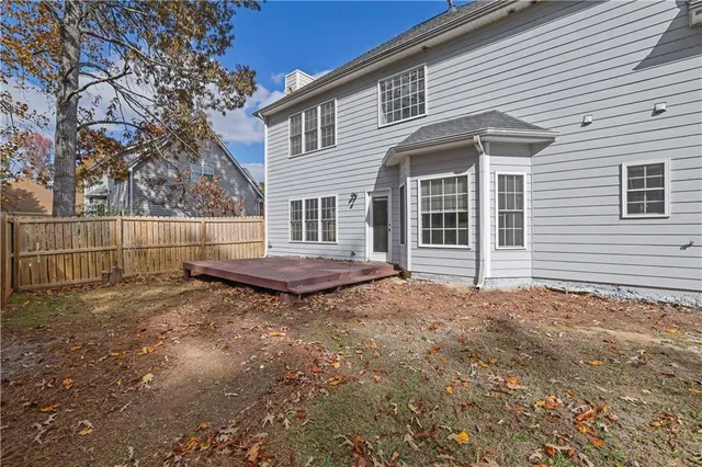 a house with trees in the background