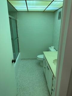 303 Racquet Club Road, Unit 201 Weston, FL 33326 - Photo 13 of 20 a bathroom with a sink and toilet