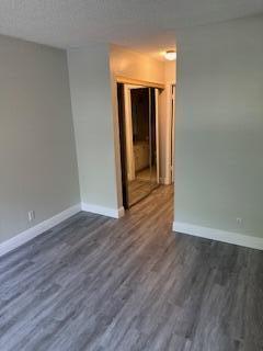 303 Racquet Club Road, Unit 201 Weston, FL 33326 - Photo 18 of 20 a view of a room with wooden floor and brick wall