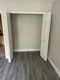 303 Racquet Club Road, Unit 201 Weston, FL 33326 - Photo 7 of 20 an empty room with wooden floor and entrance