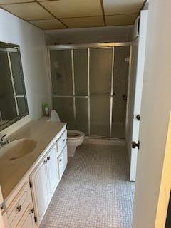 303 Racquet Club Road, Unit 201 Weston, FL 33326 - Photo 8 of 20 a bathroom with a double vanity sink toilet and shower