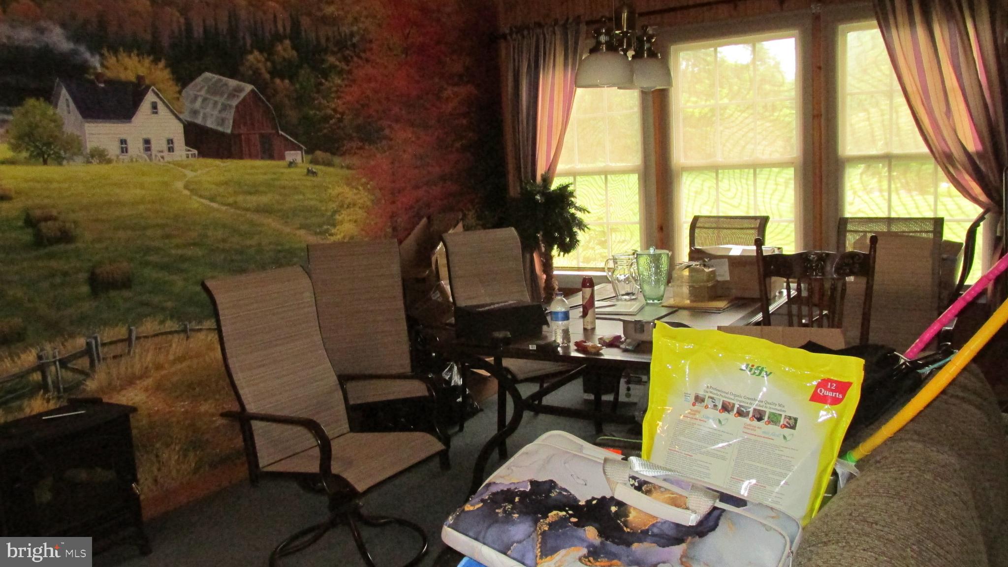 4897 Briggs Road Huntingdon, PA 16652 - Photo 15 of 29 a living room with furniture and large windows