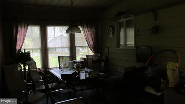 a living room filled with furniture and a table