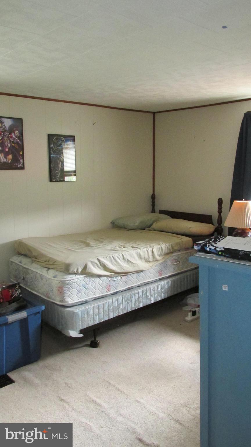 4897 Briggs Road Huntingdon, PA 16652 - Photo 20 of 29 a bedroom with a bed and cabinet