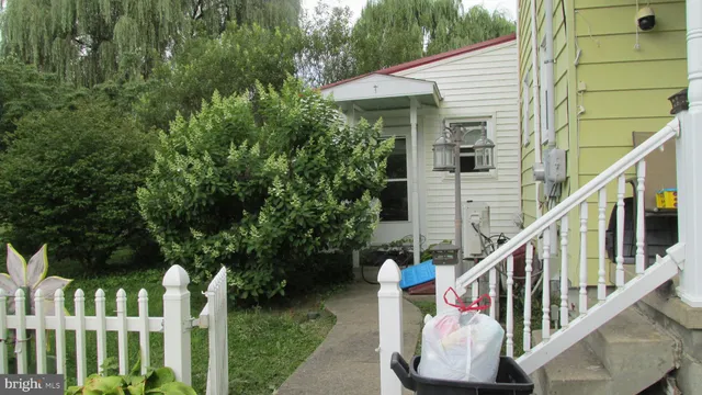 a view of deck with furniture and garden