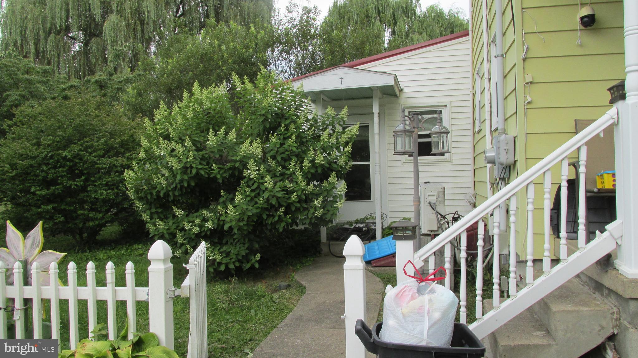4897 Briggs Road Huntingdon, PA 16652 - Photo 2 of 29 a view of deck with furniture and garden