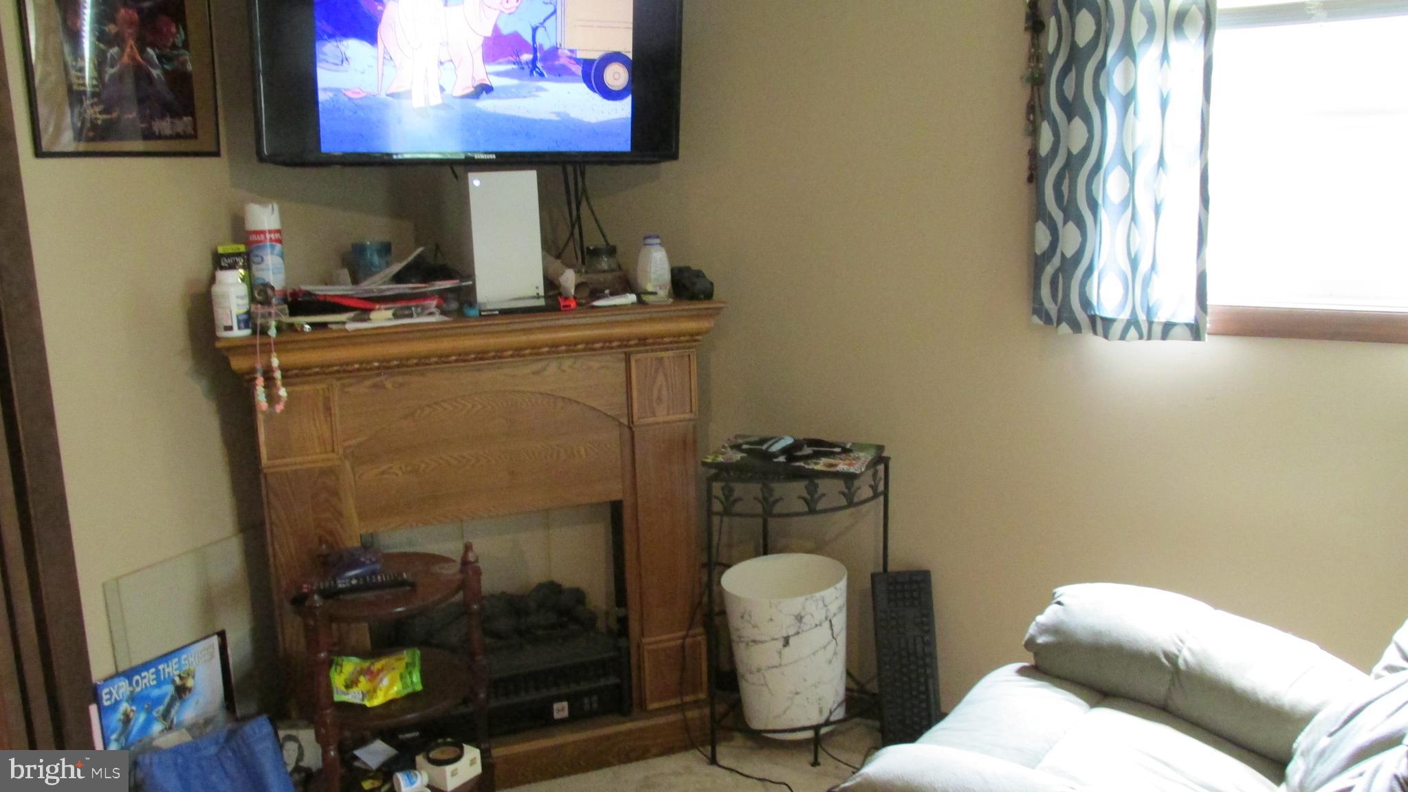 4897 Briggs Road Huntingdon, PA 16652 - Photo 25 of 29 a bathroom with a sink mirror and vanity