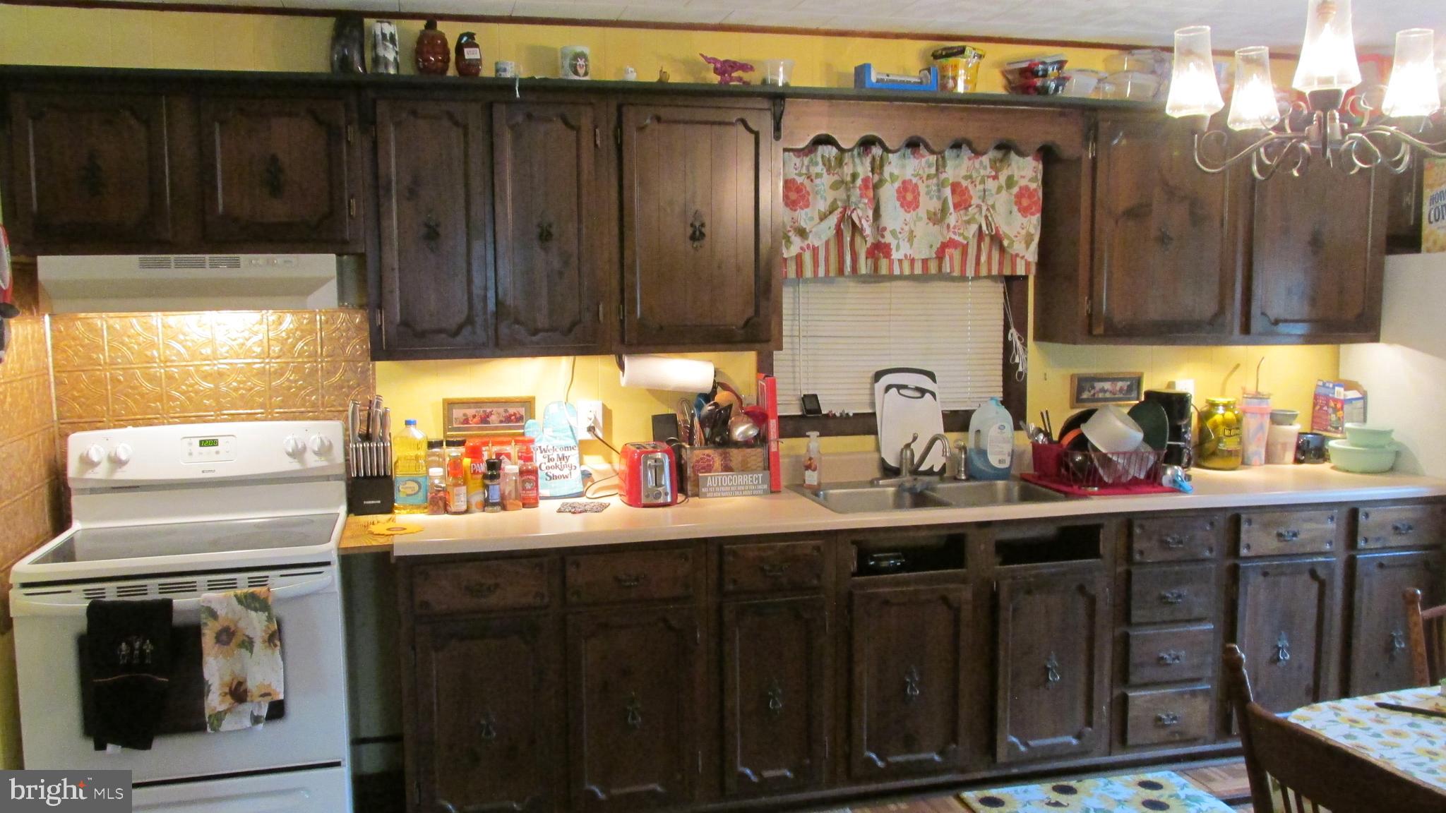 4897 Briggs Road Huntingdon, PA 16652 - Photo 27 of 29 a kitchen with a sink cabinets and appliances