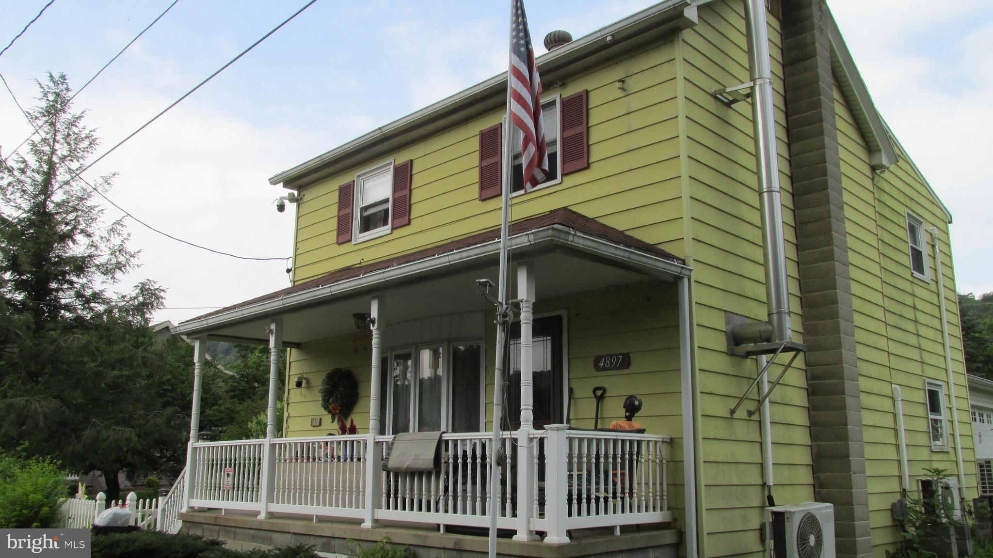 4897 Briggs Road Huntingdon, PA 16652 - Photo 3 of 29 a view of a house with a porch