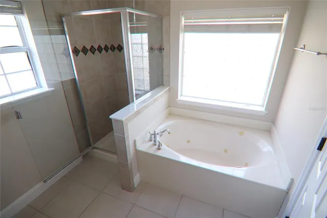 a white bath tub sitting next to a window