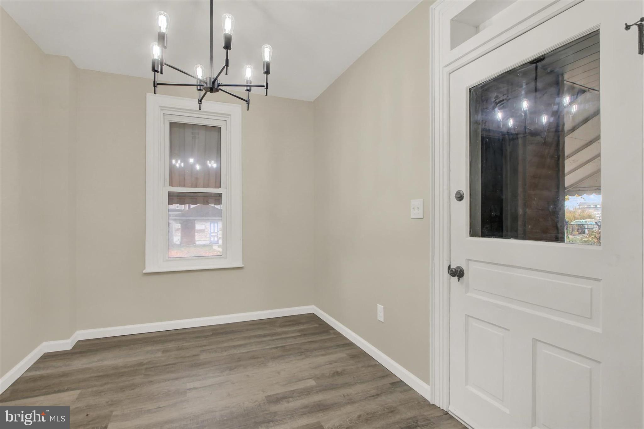 551 York Street Hanover, PA 17331 - Photo 11 of 24 an empty room with wooden floor and windows