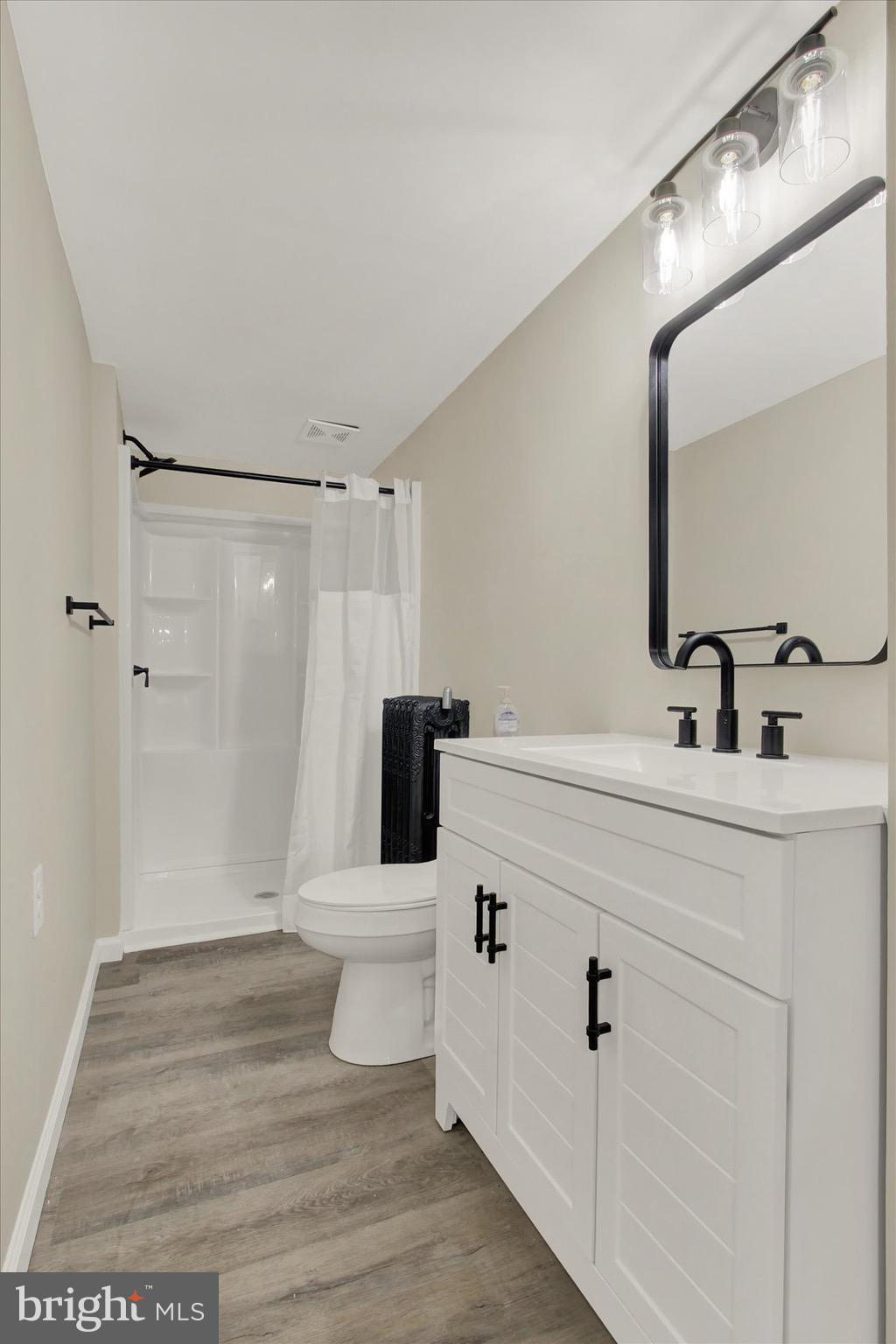 551 York Street Hanover, PA 17331 - Photo 14 of 24 a bathroom with a sink a toilet and shower