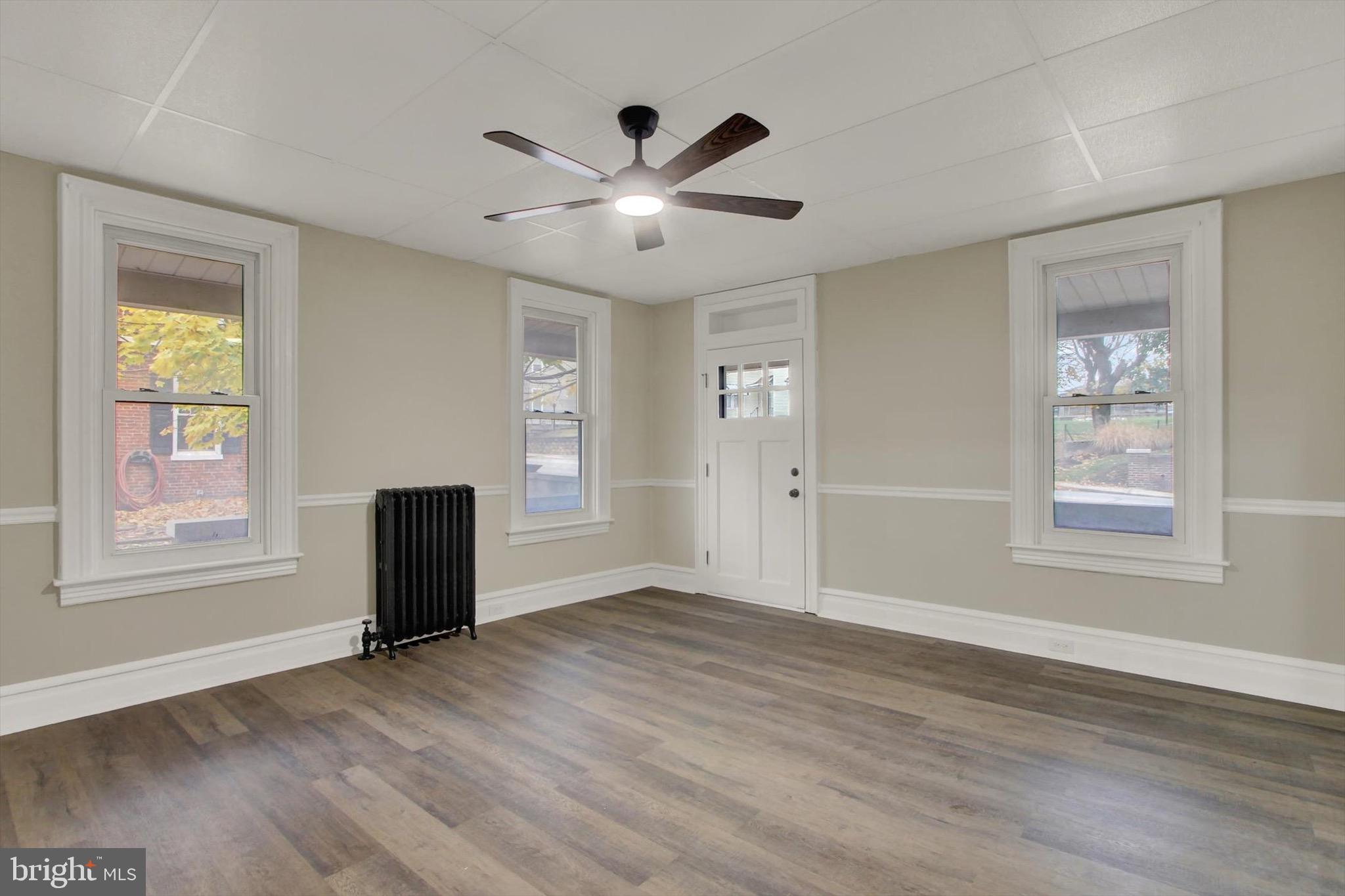 551 York Street Hanover, PA 17331 - Photo 4 of 24 a view of an empty room with wooden floor and a window