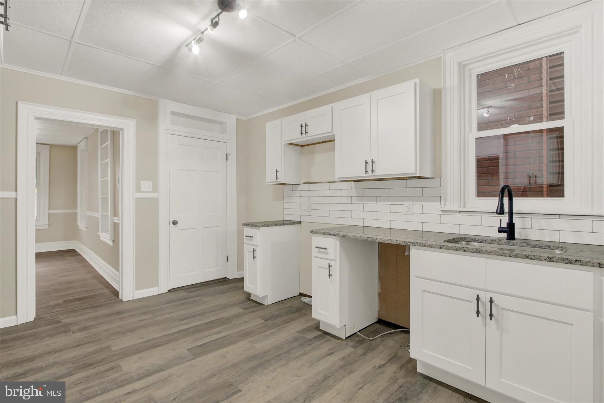 551 York Street Hanover, PA 17331 - Photo 9 of 24 a kitchen with a sink cabinets and wooden floor