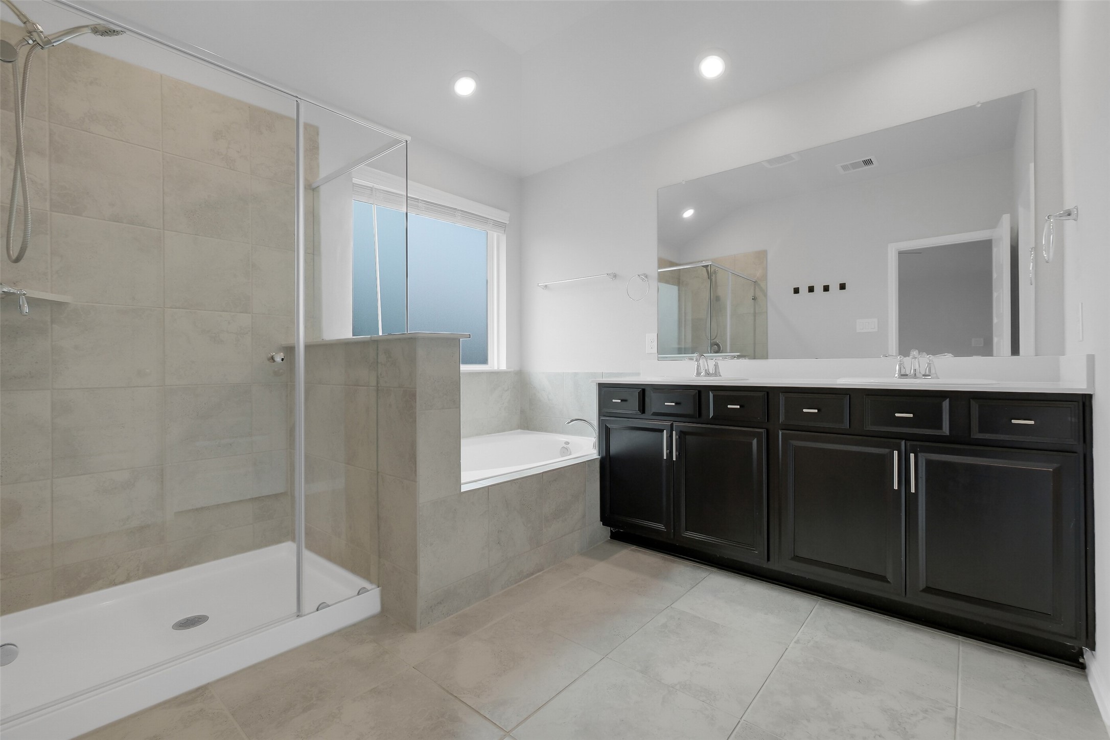 2442 Goddard Grn Drive Rosharon, TX 77583 - Photo 17 of 34 a bathroom with a double vanity sink mirror and shower