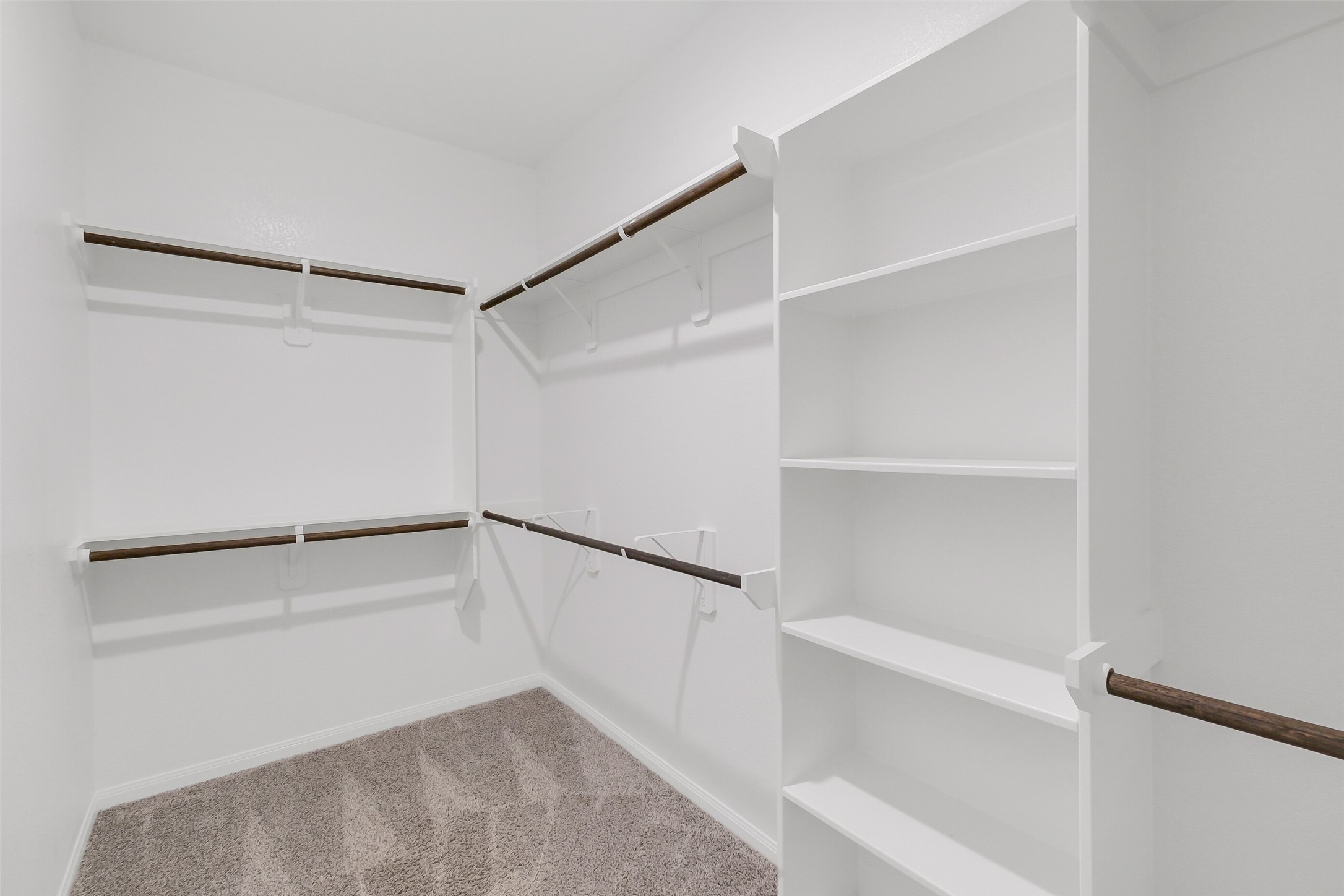 2442 Goddard Grn Drive Rosharon, TX 77583 - Photo 19 of 34 a view of an empty walk in closet