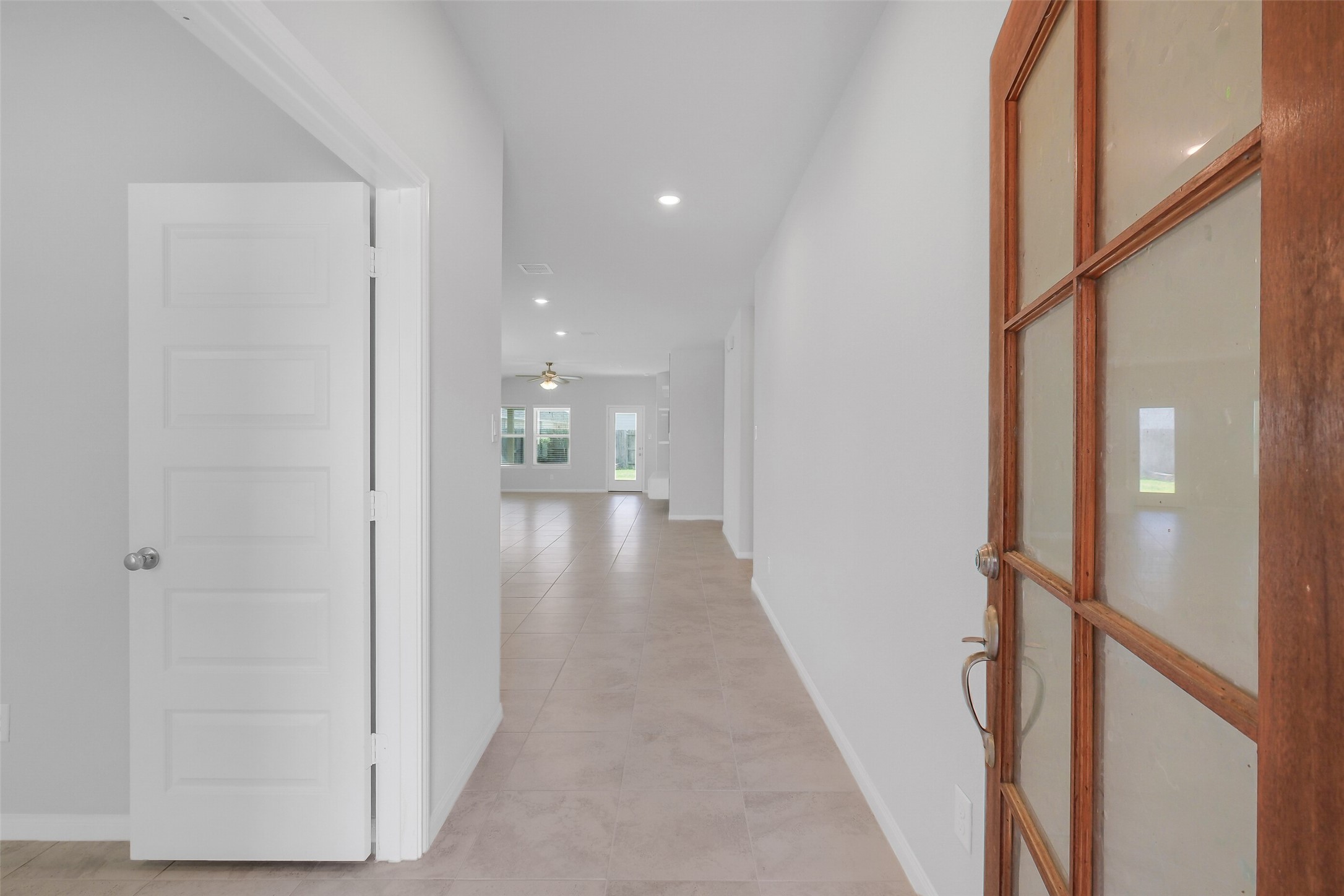 2442 Goddard Grn Drive Rosharon, TX 77583 - Photo 3 of 34 a view of a hallway with wooden floor