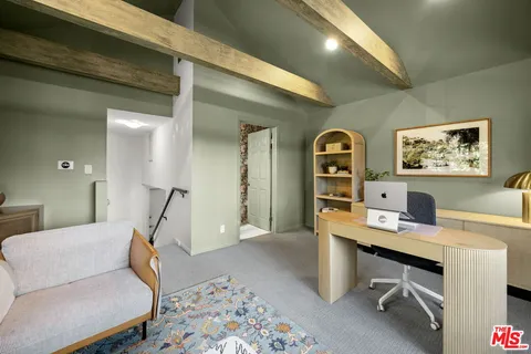 a workspace with furniture and window