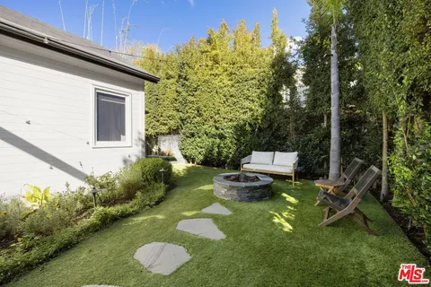 a backyard of a house with lots of green space