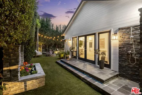 a outdoor space with lots of furniture and garden