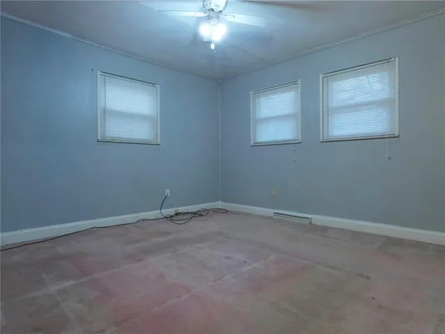 a view of an empty room with a fan