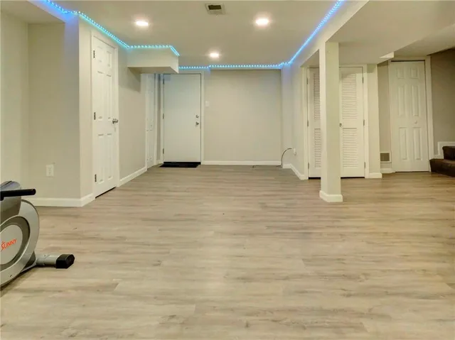 a white toilet sitting next to a shower