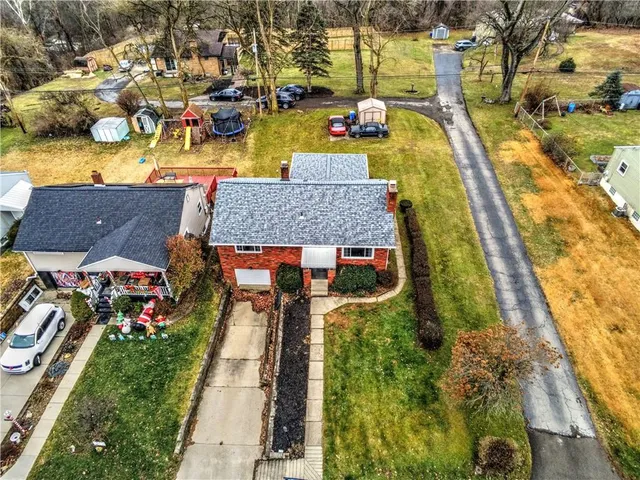 an aerial view of a house with a ocean view