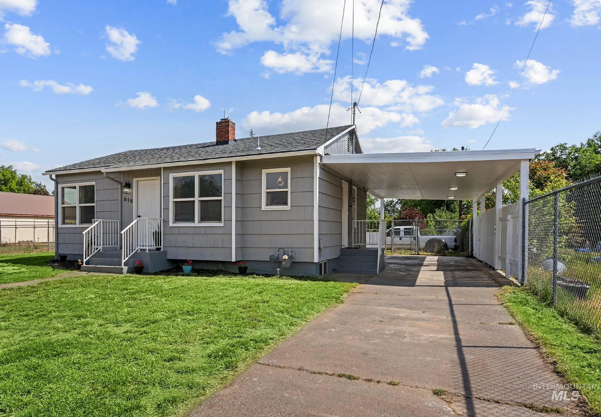 619 Thain Road Lewiston, ID 83501 - Photo 1 of 44 Single-story home featuring gray horizontal siding and a dark shingle roof