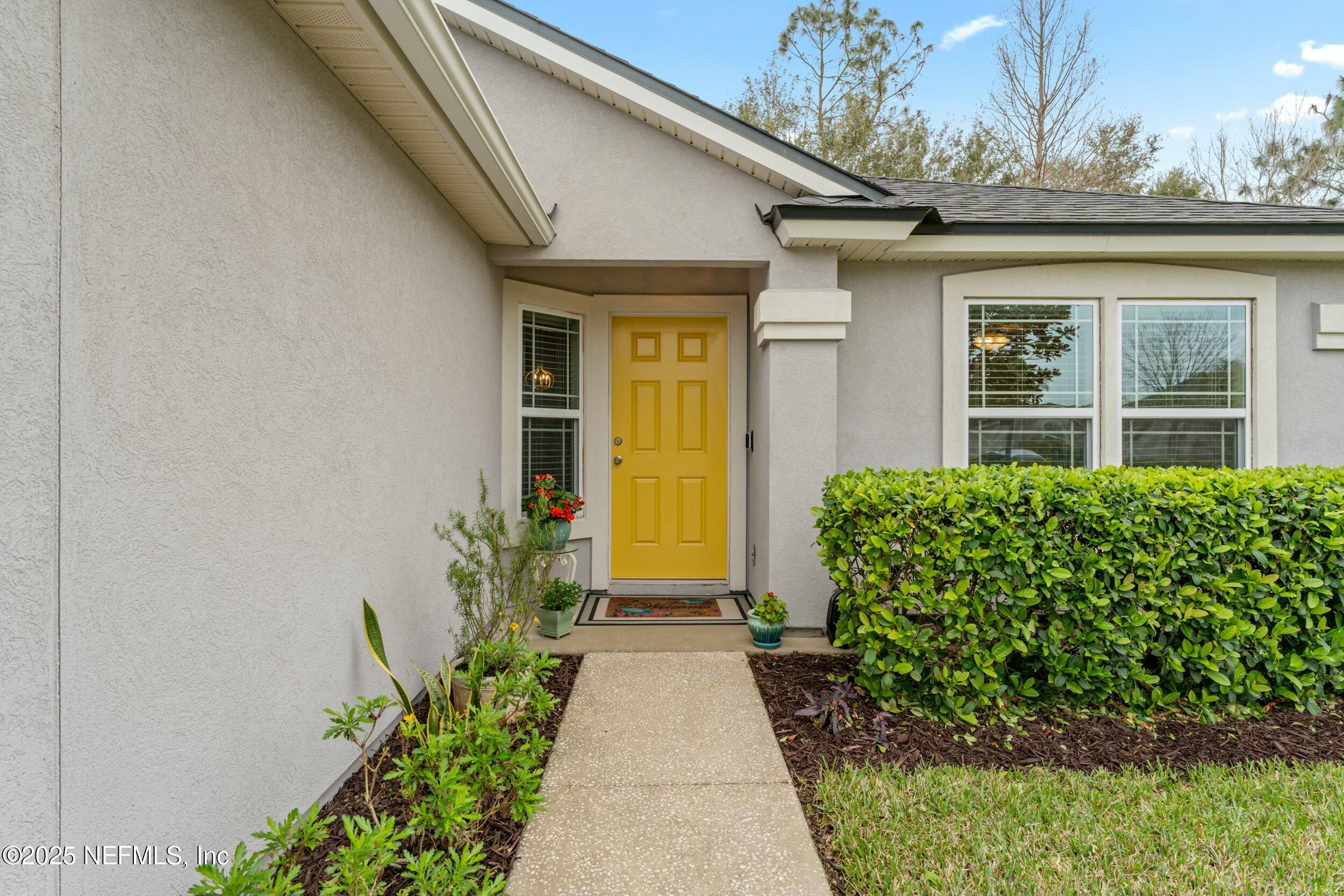 340 Sunshine Drive St. Augustine, FL 32086 - Photo 12 of 44 a view of a pathway with house in front of it
