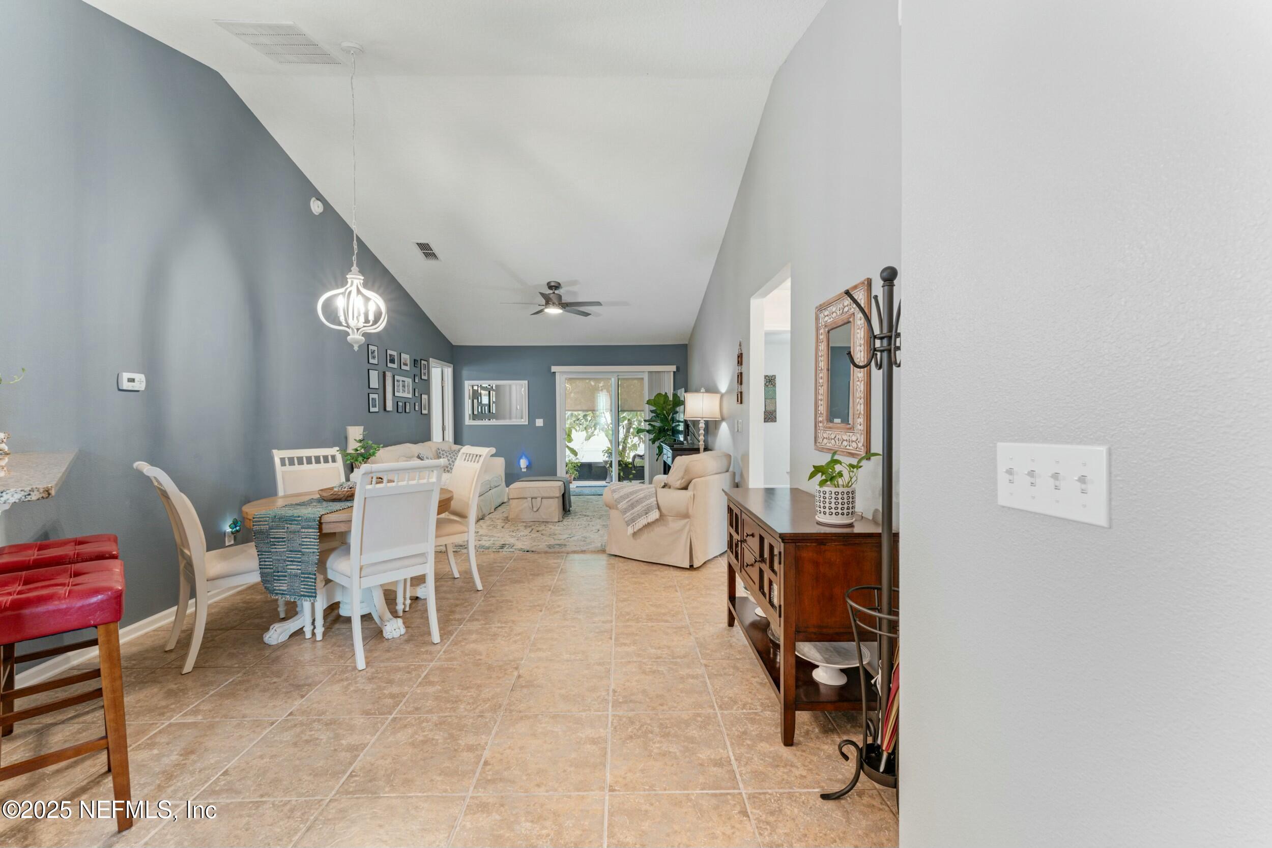 340 Sunshine Drive St. Augustine, FL 32086 - Photo 13 of 44 a living room with furniture and a table