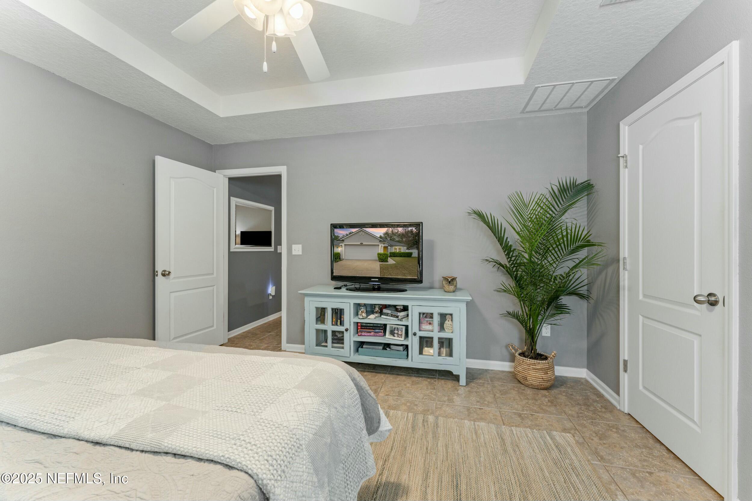 340 Sunshine Drive St. Augustine, FL 32086 - Photo 24 of 44 a bedroom with furniture and a flat screen tv