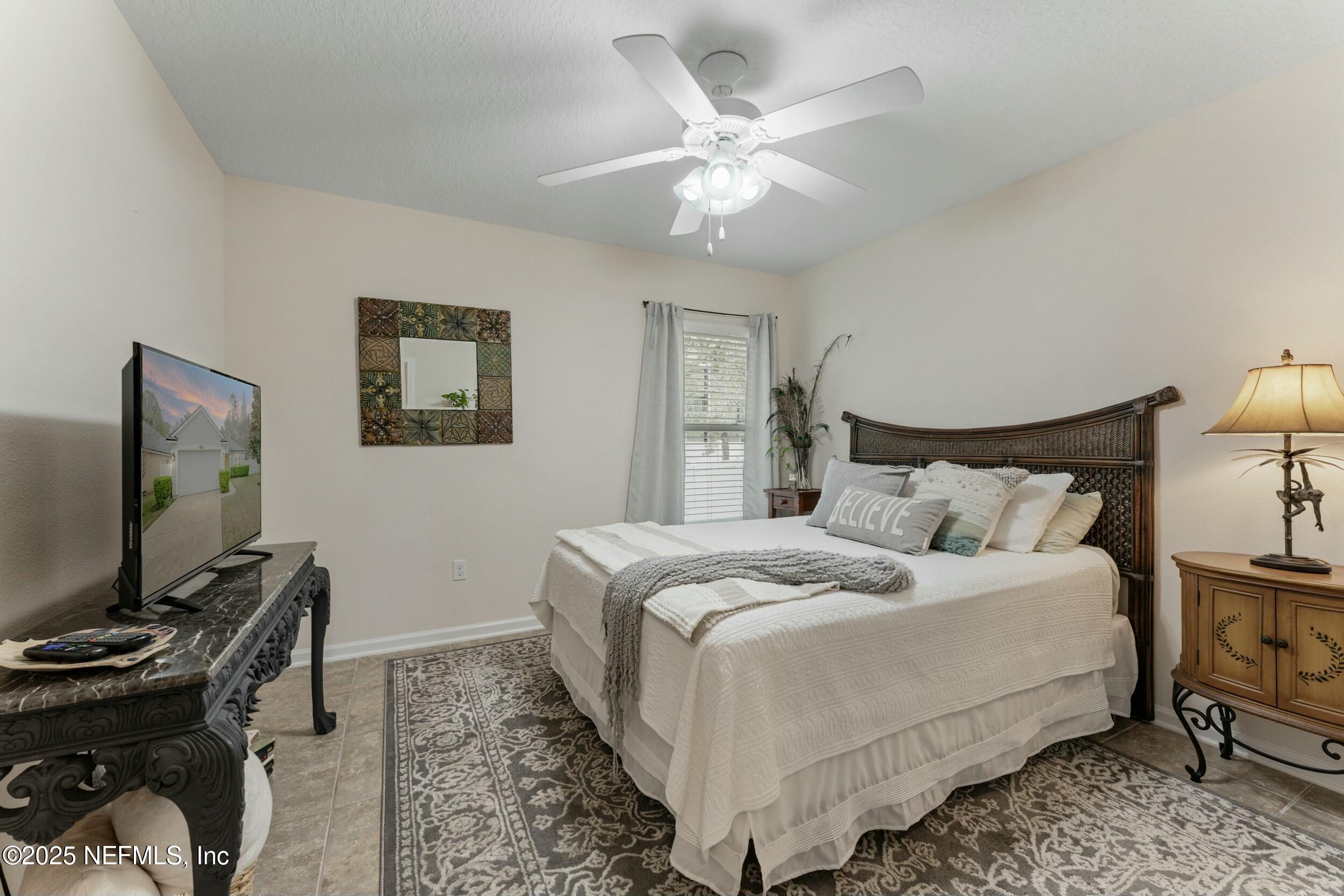 340 Sunshine Drive St. Augustine, FL 32086 - Photo 25 of 44 a bedroom with a bed and a flat screen tv