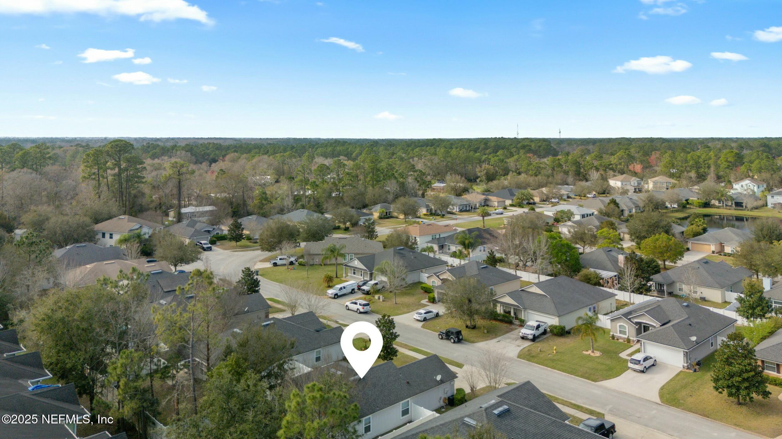 340 Sunshine Drive St. Augustine, FL 32086 - Photo 37 of 44 an aerial view of a house with a yard