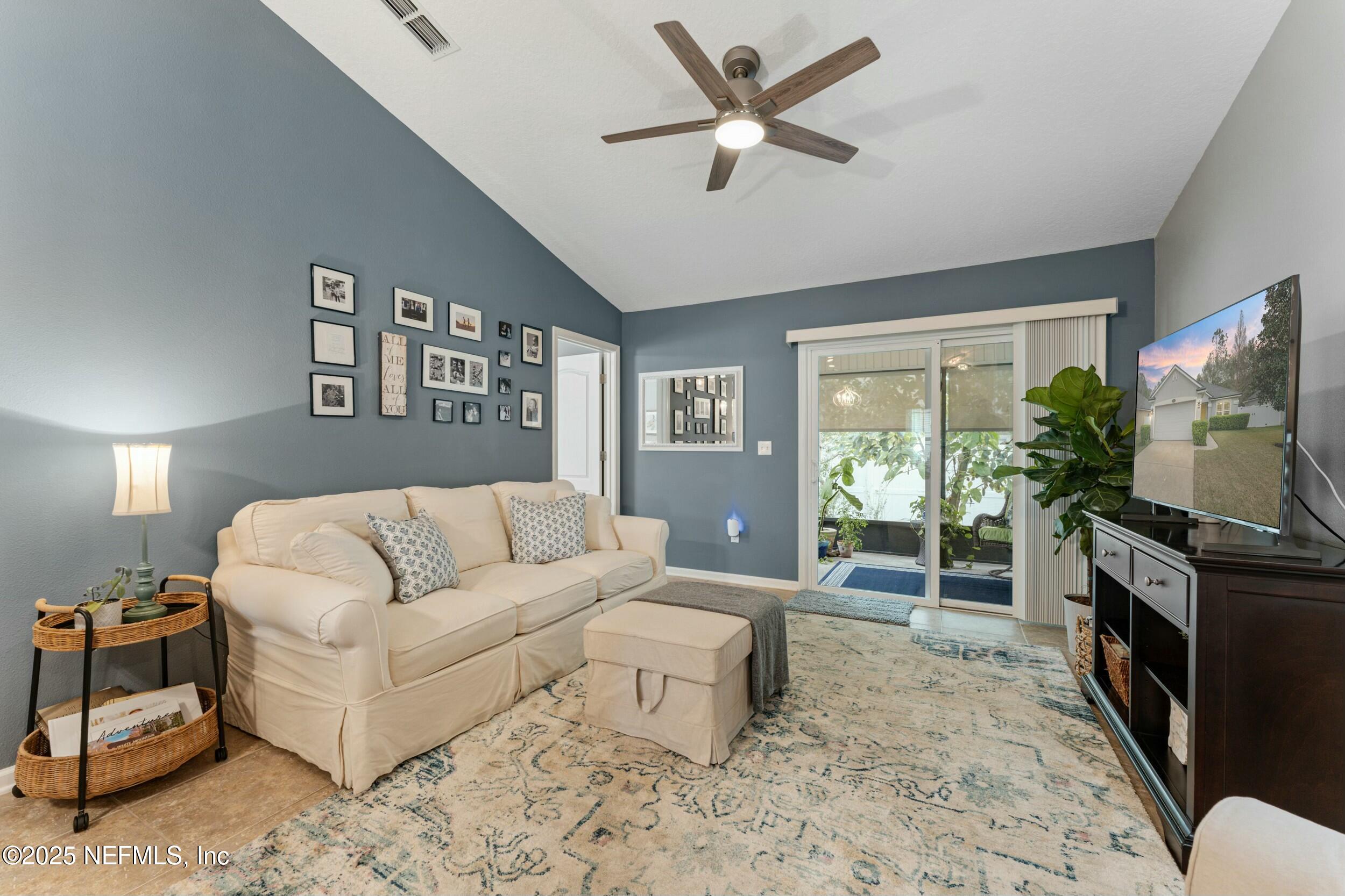 340 Sunshine Drive St. Augustine, FL 32086 - Photo 4 of 44 a living room with furniture and a flat screen tv
