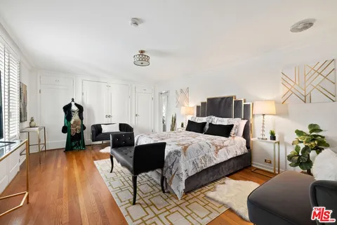 a bed room with two bed and a couch