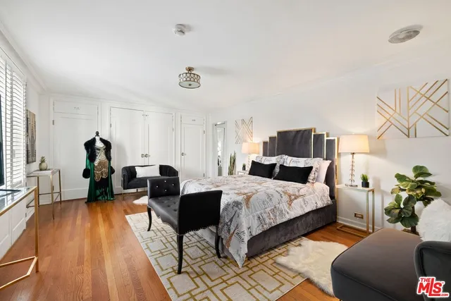 a bed room with two bed and a couch