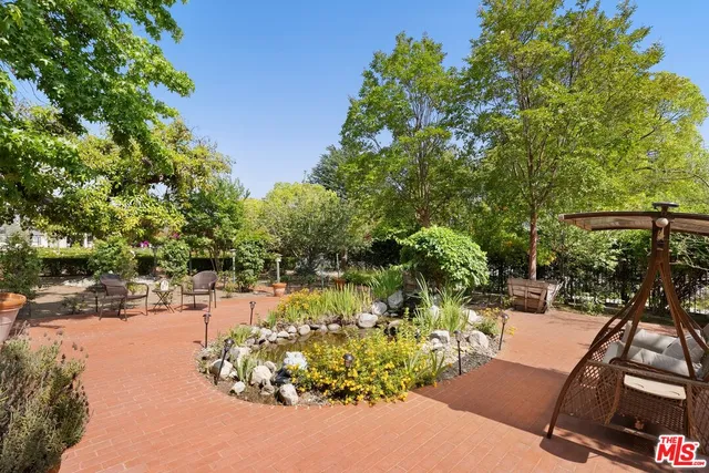 a view of a backyard of the house