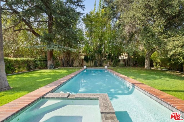 a view of a backyard with a small pool