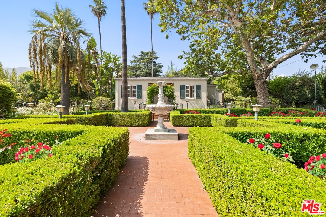 820 North Verano Drive Glendora, CA 91741 - Photo 4 of 50 a front view of a house with fountain and garden