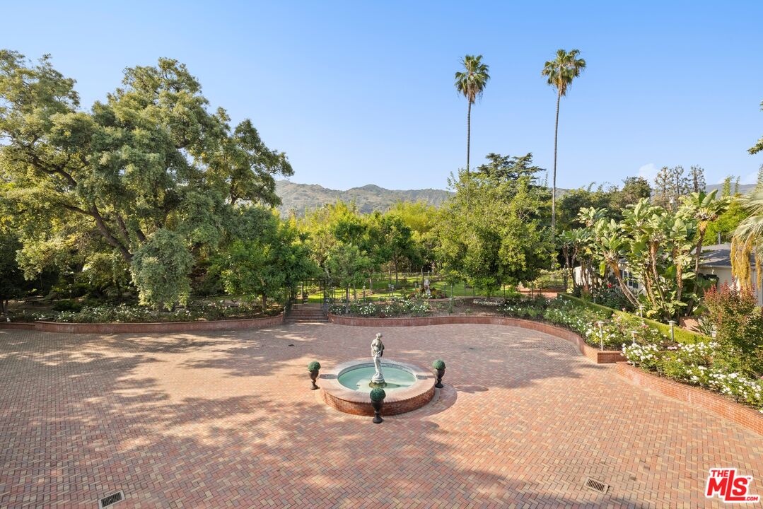 820 North Verano Drive Glendora, CA 91741 - Photo 42 of 50 a backyard of a house with table and chairs potted plants