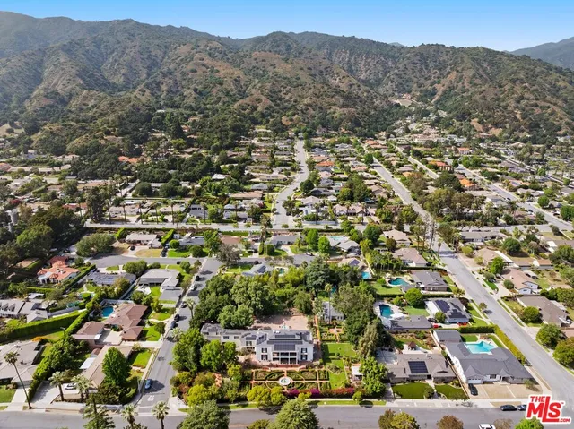 a swimming pool with outdoor seating and patio