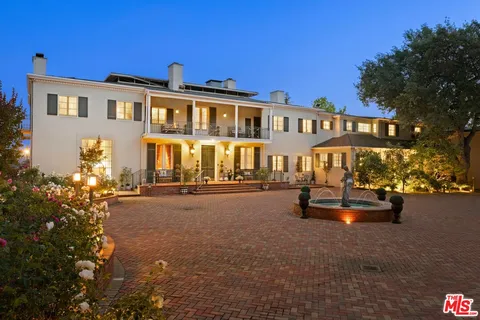 a view of street with flower plants