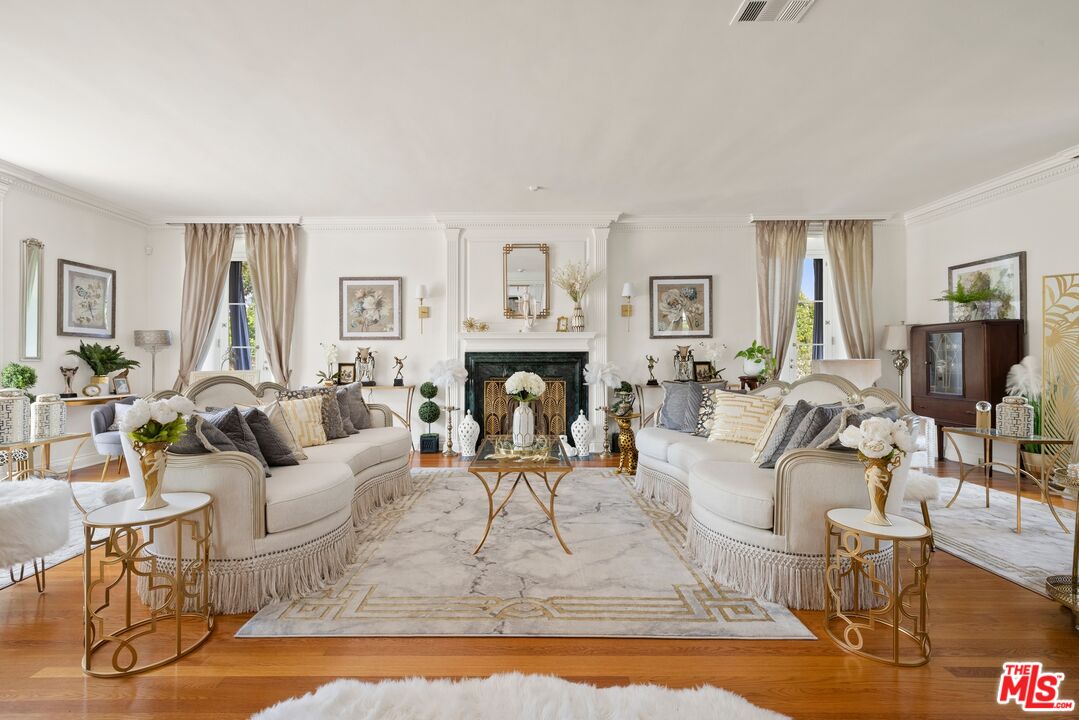820 North Verano Drive Glendora, CA 91741 - Photo 8 of 50 a living room with fireplace furniture and a wooden floor