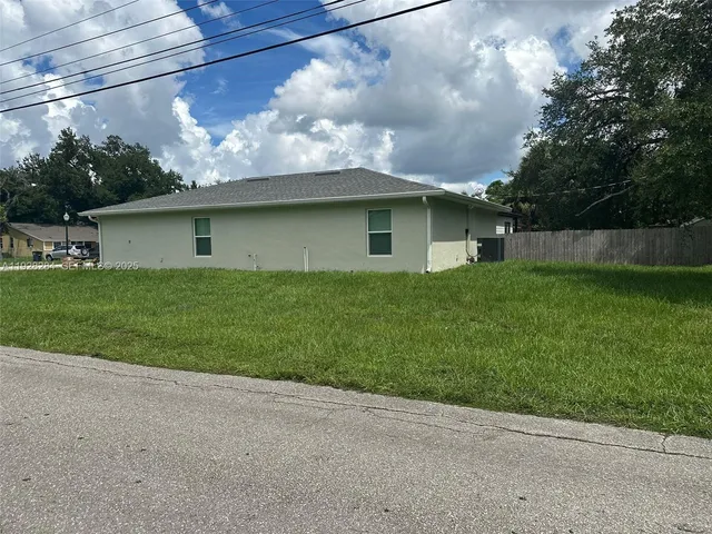 a backyard of a house with lots of green space
