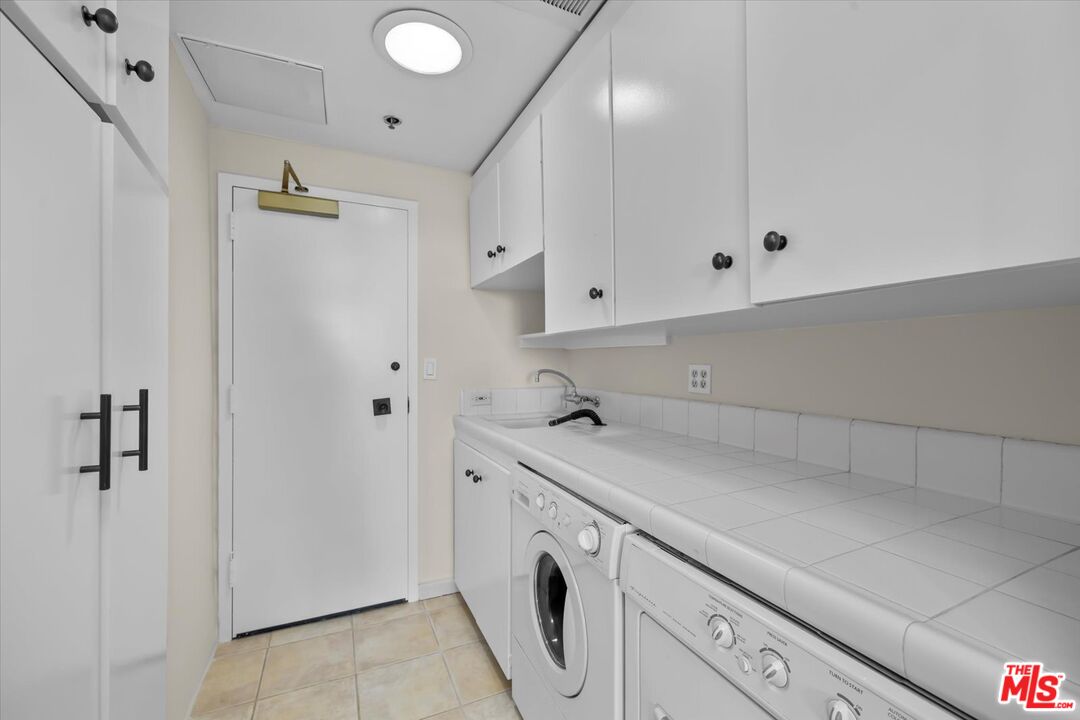 1333 South Beverly Glen Boulevard, Unit 904 Los Angeles, CA 90024 - Photo 19 of 32 a view of cabinets and utility room with closet