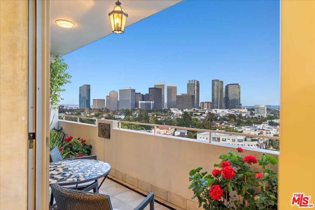 1333 South Beverly Glen Boulevard, Unit 904 Los Angeles, CA 90024 - Photo 20 of 32 a view of balcony with outdoor seating and city view